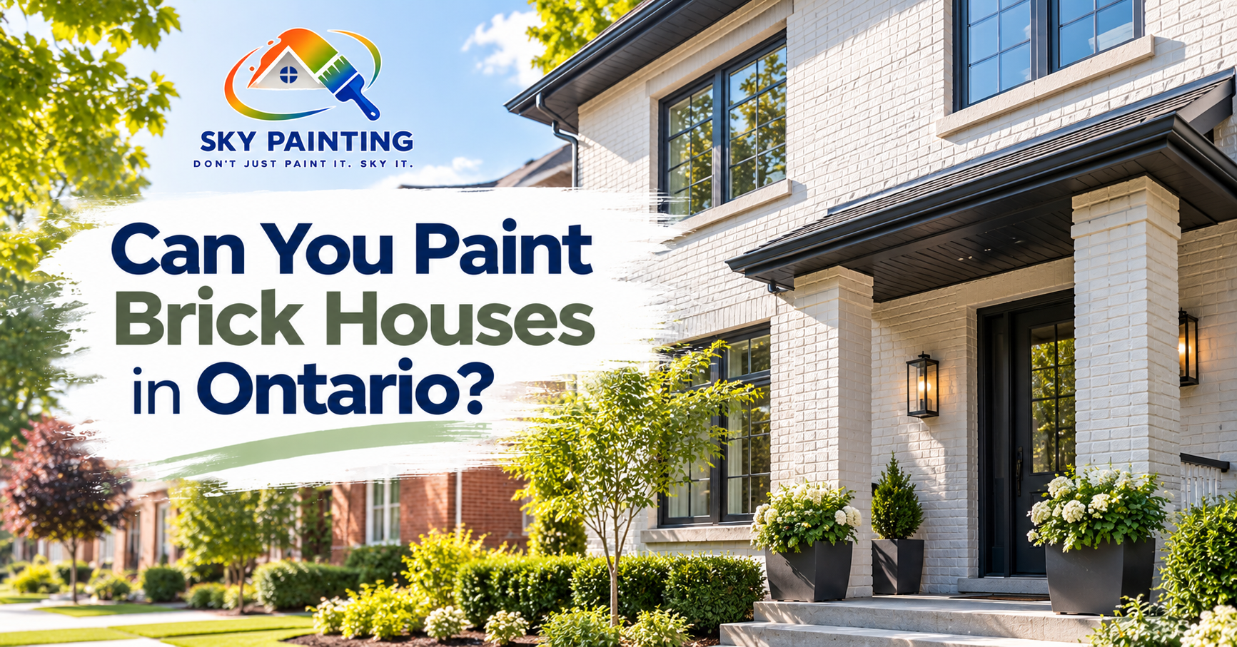 Painted brick exterior of a Toronto home in warm grey with white trim